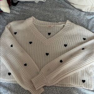 White V-Neck Sweater with Black Heart Accents